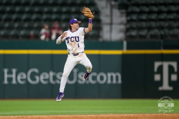 Peyton Chatagnier leaps up to keep a ball in the infield.